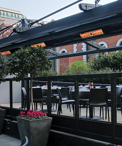 Solaira XL Series heaters on a restaurant patio in the city