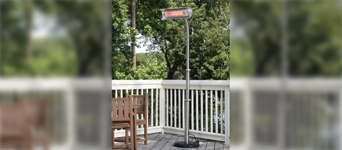 Residential deck with gray deck planks, white railing and a Fire Sense 02117 1500W Telescoping Offset Pole Mounted Infrared Patio Heater