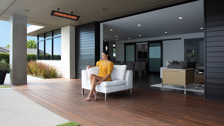 One Black Finish Electric Heater with Decorative Faceplate Ceiling Mounted on Outdoor Patio