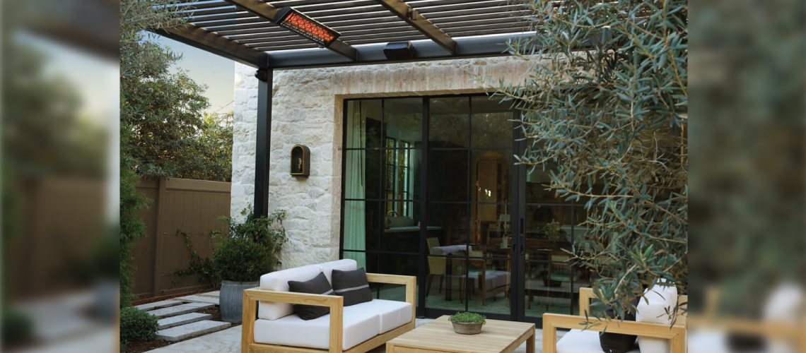  one electric patio heater hanging from the beam of an outdoor gazebo over a modern patio set up