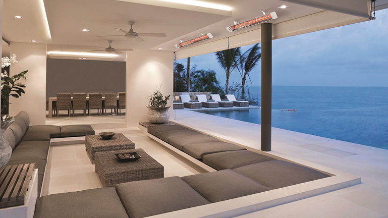 Two Electric Patio Heaters Wall Mounted Above Outdoor Covered Patio Seating Area 
