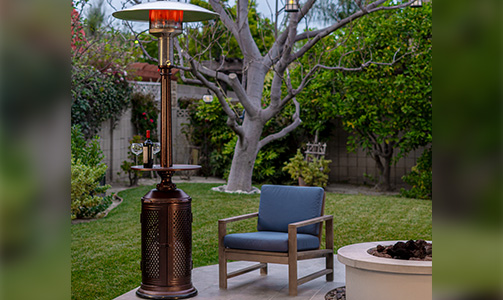 One Mushroom Heater with Tabletop for Drinks Next to an Outdoor Chair and Fire Pit in Backyard 