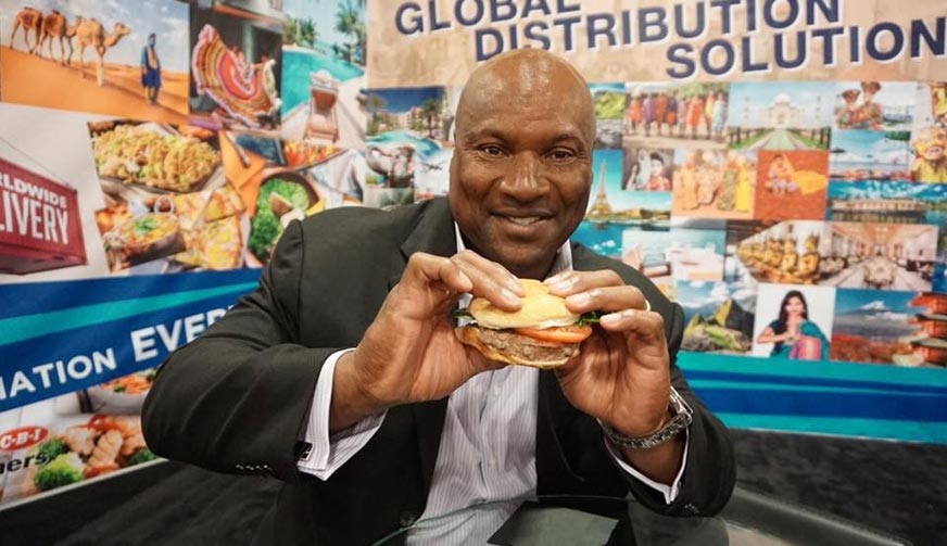 Bo Jackson enjoying a hamburger from his Bo Jackson’s 34 Beef Tailgating Pack