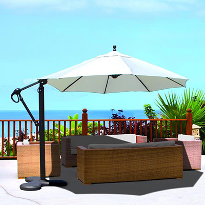 white canopy cantilever umbrella shading a patio furniture set