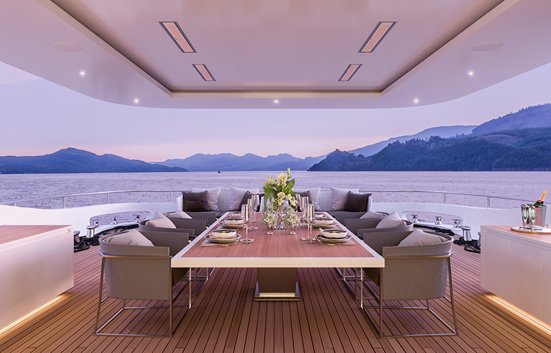 recessed marine grade heaters over a dining table with water in the background at evening
