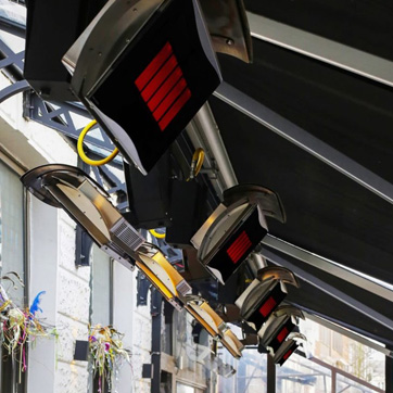 line of mounted gas heaters in a restaurant