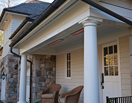 hanging gas tungsten heaters over a patio with a foggy mountain view
