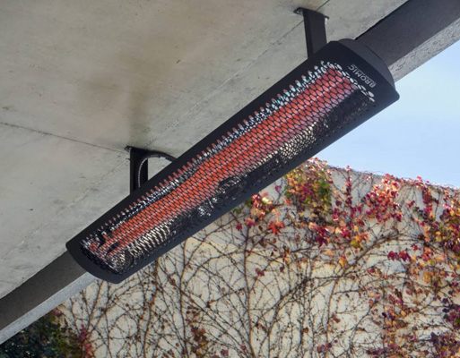 hanging gas tungsten heaters over a patio with a foggy mountain view