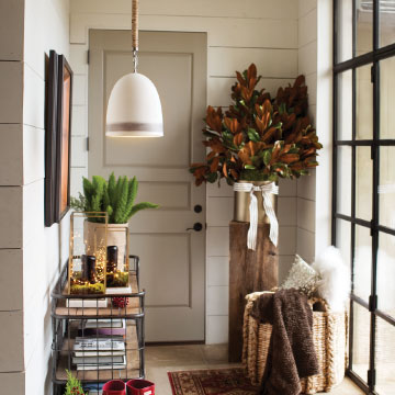 white farmhouse pendant hanging in an entryway