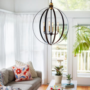 globe pendant in a bright white living room